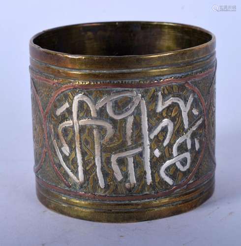 A MIDDLE EASTERN SILVER INLAID NAPKIN RING. 58 grams. 4 cm w...