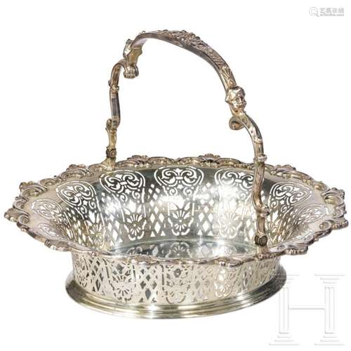 A large German silver basket with movable handle, probably H...