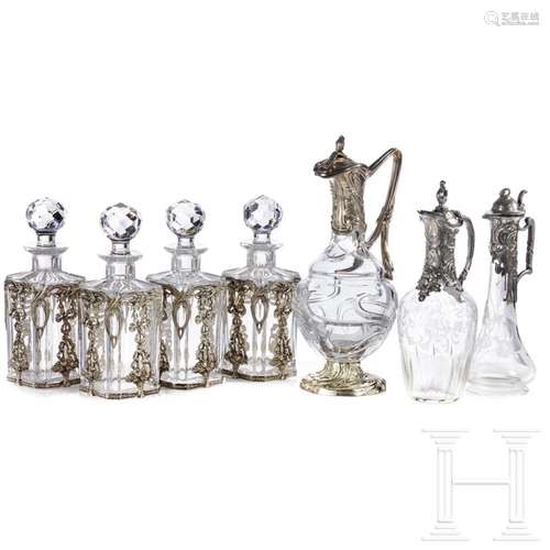 Seven partly silver-mounted glass carafes, circa 1920 - 1970