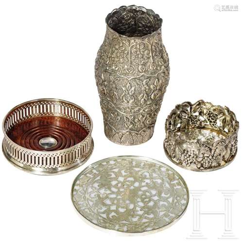 A silver vase, a table trivet and two coasters, circa 1900 -...