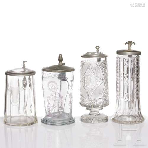 Four German pewter-mounted glass jugs, 19th century