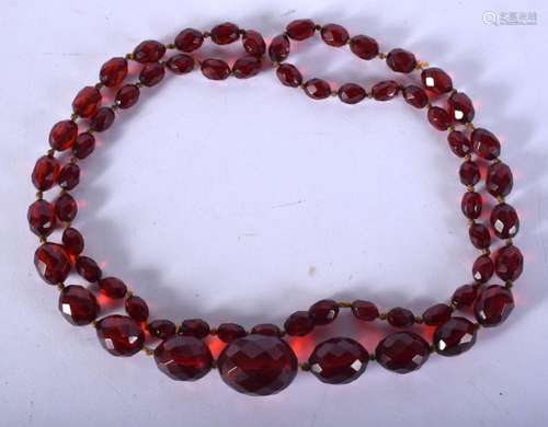 A CHERRY RED BEAD NECKLACE. 45 grams. 86 cm long.