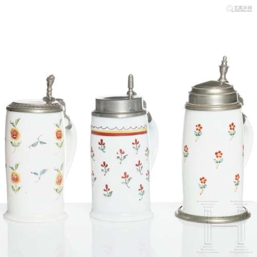 Three German or Bohemian tin-mounted milk glass jugs, circa ...