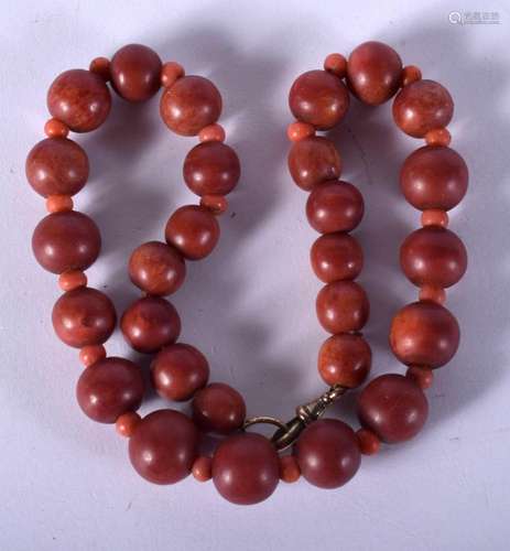 A VINTAGE RED BEAD NECKLACE. 54 grams. 38 cm long.