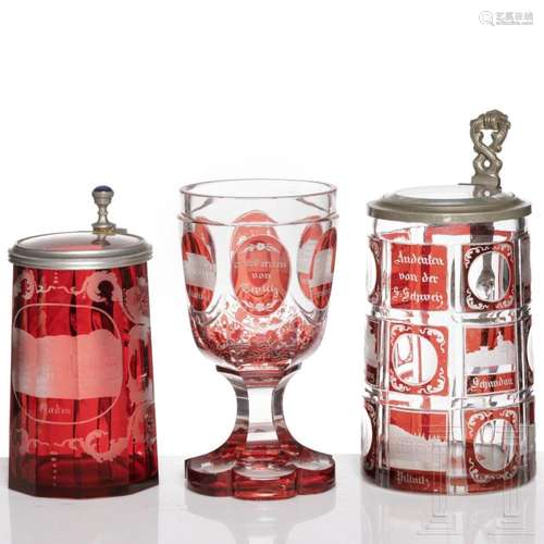 Two Bohemian ruby glazed, pewter-mounted jugs and one beaker...