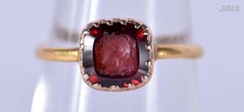 A FINE ANTIQUE 22CT GOLD AND RUBY CAMEO RING. L. 1.9 grams.