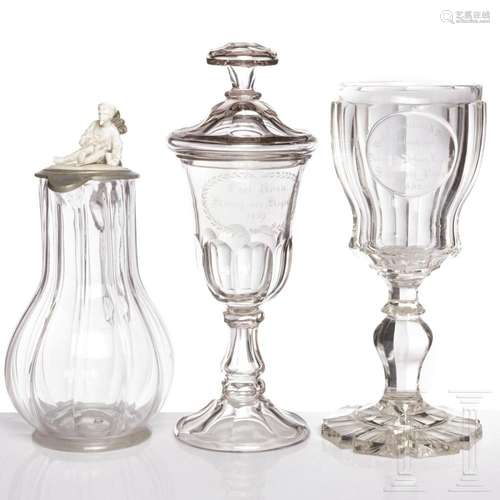 A glass goblet with cover, a goblet and a pewter-mounted jug...