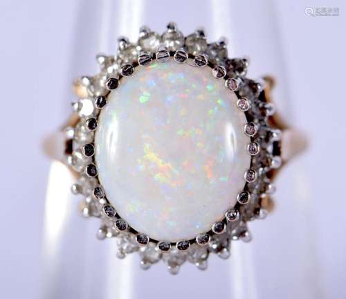 A 9CT GOLD OPAL AND DIAMOND RING. M. 3.4 grams.