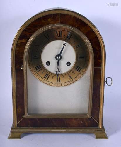 AN ANTIQUE TORTOISESHELL CASED MANTEL CLOCK with brass dial....