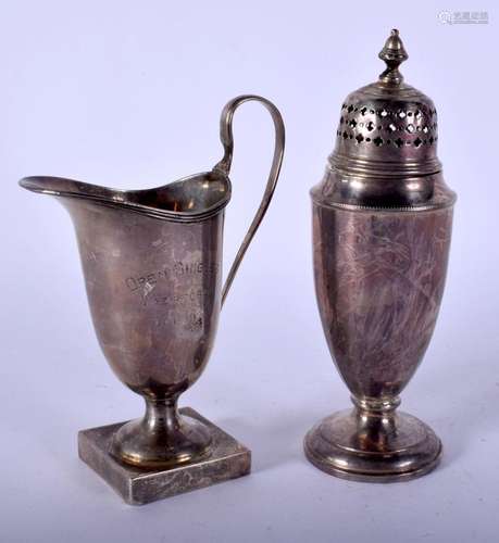 A SILVER CREAM JUG and a silver sifter. Birmingham 1917 &...