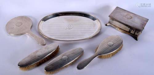 A 1940S ENGLISH SILVER DRESSING TABLE SET including a tray e...