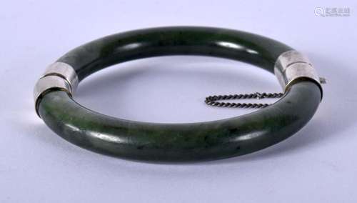 A SILVER AND JADE BANGLE. 50 grams. 6 cm wide.