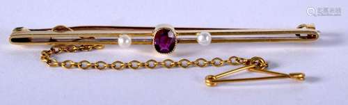 A VICTORIAN 15CT GOLD AND RUBY BROOCH. 3.6 grams. 5.5 cm wid...