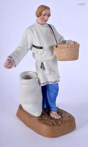 A 19TH CENTURY RUSSIAN BISQUE PORCELAIN FIGURE OF A FARMER m...