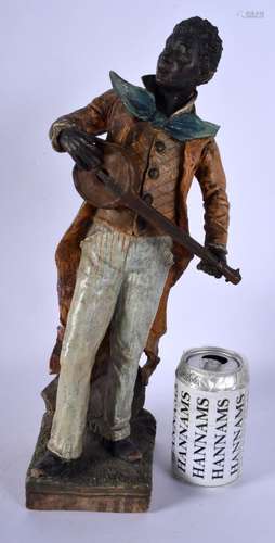 A 19TH CENTURY AUSTRIAN COLD PAINTED TERRACOTTA MUSICIAN. 38...