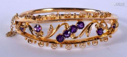 A LOVELY 9CT GOLD AND AMETHYST BANGLE. 9.6 grams. 5.5 cm x 5...