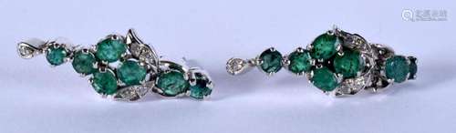 A PAIR OF WHITE METAL EMERALD EARRINGS. 4.9 grams. 3 cm long...