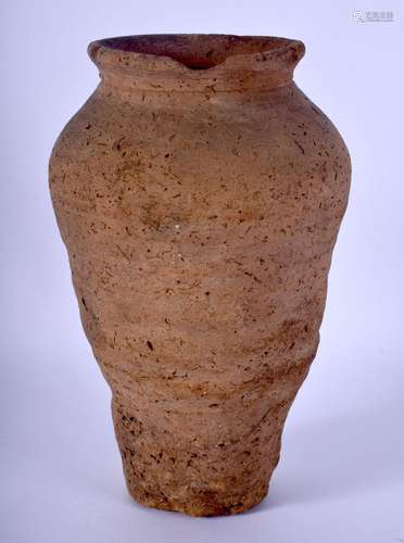 AN EARLY SOUTHERN EUROPEAN POTTERY VASE. 21 cm high.