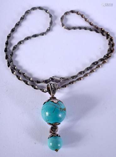 A WHITE METAL TURQUOISE NECKLACE. 22 grams. 44 cm long, pend...