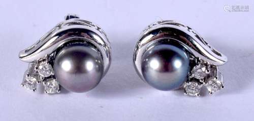 A PAIR OF WHITE METAL BLACK PEARL EARRINGS. 10 grams. 1.5 cm...