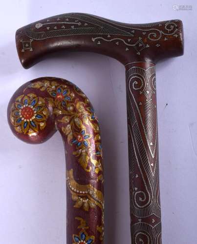 AN ANTIQUE SILVER INLAID ANGLO INDIAN WALKING CANE and anoth...