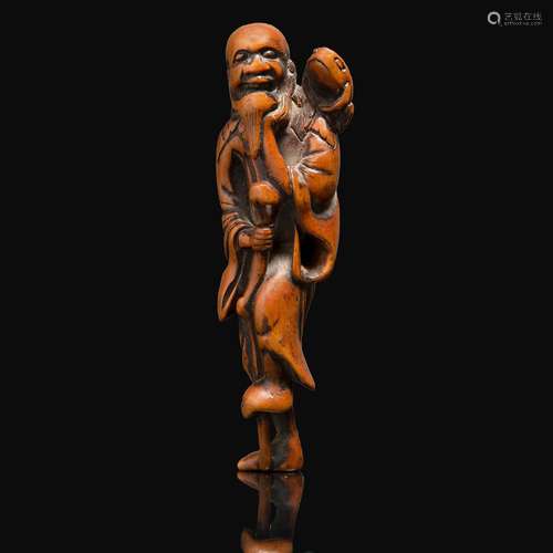 NETSUKE en buis, représentant Gama-Sennin debout sur un pied...