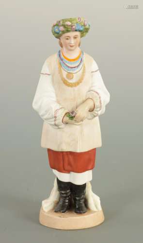 AN EARLY 20TH CENTURY RUSSIAN STANDING BISQUE FIGURE OF A FL...