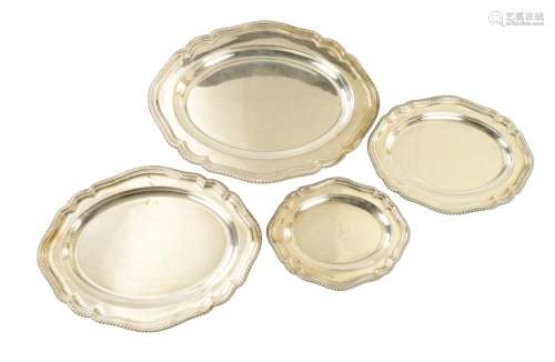 A SET OF FOUR REGENCY SILVER PLATE SCALLOP-EDGE OVAL SERVING...