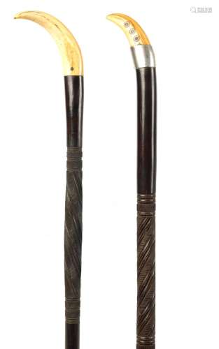 TWO LATE 19TH CENTURY AFRICAN HARDWOOD WALKING STICKS WITH L...