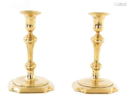 A PAIR OF MID 18TH CENTURY CAST BRASS CANDLESTICKS