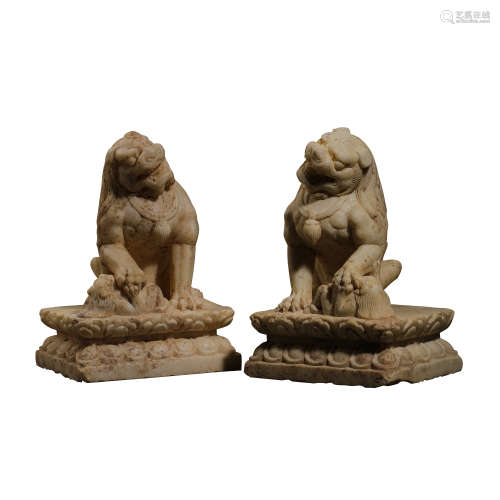 A PAIR OF CHINESE TANG DYNASTY WHITE MARBLE CARVED LIONS, 7T...