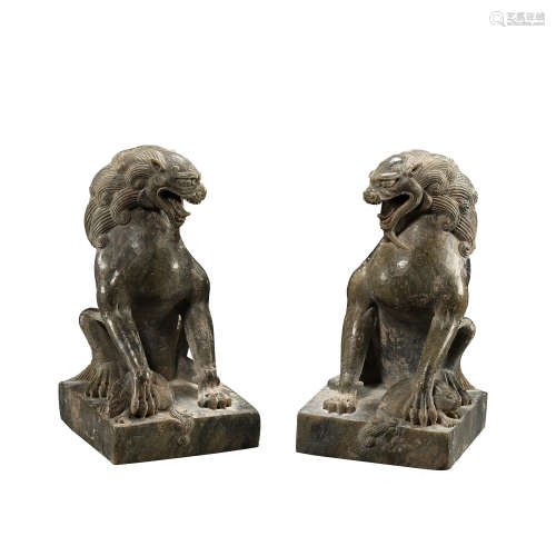 A PAIR OF CHINESE TANG DYNASTY BLUESTONE LIONS, 7TH CENTURY