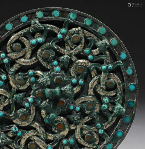 In the Han Dynasty, bronze mirror inlaid with silver and pin...