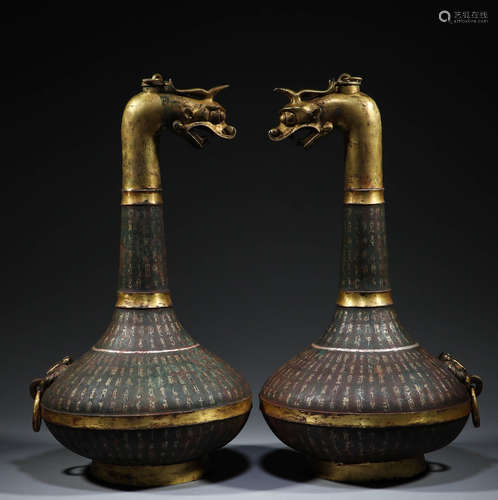 In the Han Dynasty, a pair of Bronze Dragon Head pots inlaid...