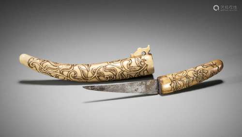 A RARE STAG ANTLER NETSUKE IN THE SHAPE OF A SAMURAI SWORD W...