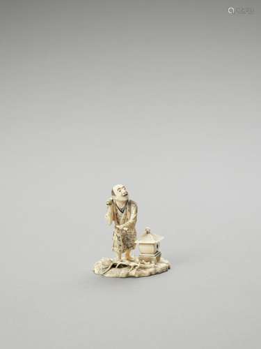 AN IVORY OKIMONO OF A TEMPLE DRUMMER