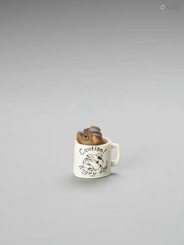 DERKACHENKO: A MAMMOTH IVORY AND BOXWOOD NETSUKE ‘CAUTION! A...