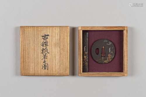 AN IRON TSUBA AND KOZUKA DEPICTING GENERAL KAN’U