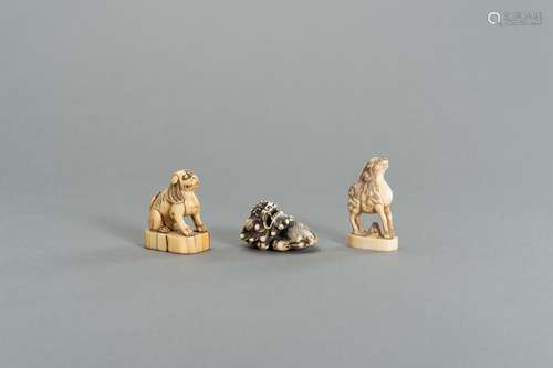 A GROUP OF THREE IVORY NETSUKE OF MYTHICAL ANIMALS