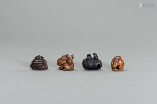 A GROUP OF FOUR WOOD NETSUKE OF ANIMALS