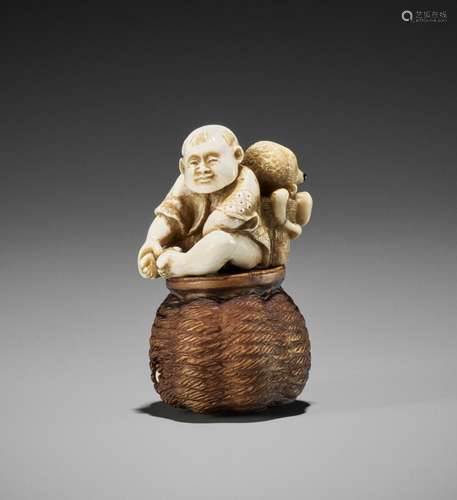 DERKACHENKO: A WOOD AND MAMMOTH IVORY SHUNGA NETSUKE OF A KA...