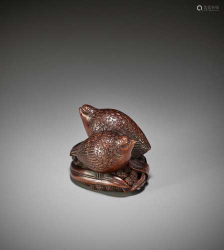 OKATOMO: A RARE STAINED WOOD NETSUKE OF TWO QUAILS ON MILLET