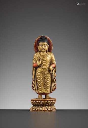 A TIBETAN-CHINESE PAINTED AND GILT IVORY FIGURE OF BUDDHA, L...