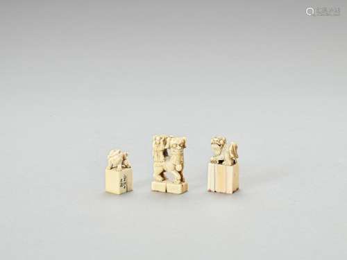 THREE CARVED IVORY ‘BUDDHIST LION’ SEALS, LATE QING