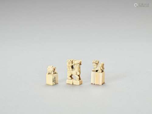 THREE CARVED IVORY ‘BUDDHIST LION’ SEALS, LATE QING