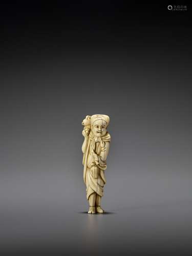 A GOOD TALL IVORY NETSUKE OF A STANDING SARUMAWASHI WITH MON...