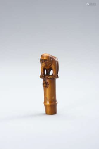 AN IVORY NETSUKE OF A MONKEY, CICADA AND BAMBOO