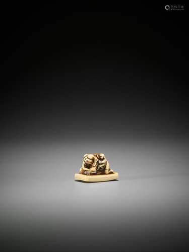 AN IVORY NETSUKE OF A SAGE WITH BAKU