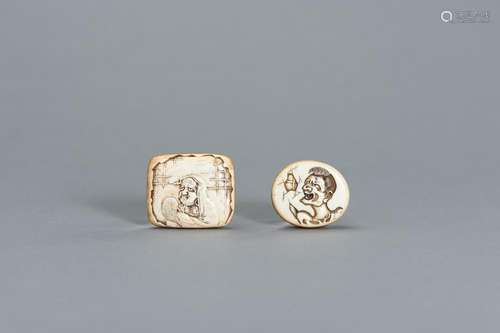 A GROUP OF TWO IVORY MANJU NETSUKE DEPICTING DARUMA