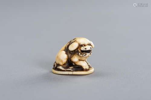 GYOKUYOSAI: AN IVORY NETSUKE OF A SHISHI